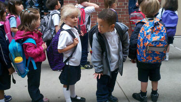 Kindergarteners lined up on the first day of school