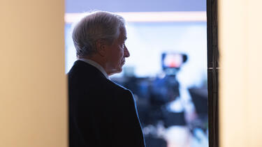Jamie Dimon silhouetted in a doorway